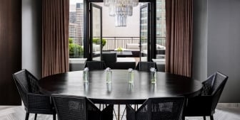 A large circular dinner table in the Gwen Lux Suite.