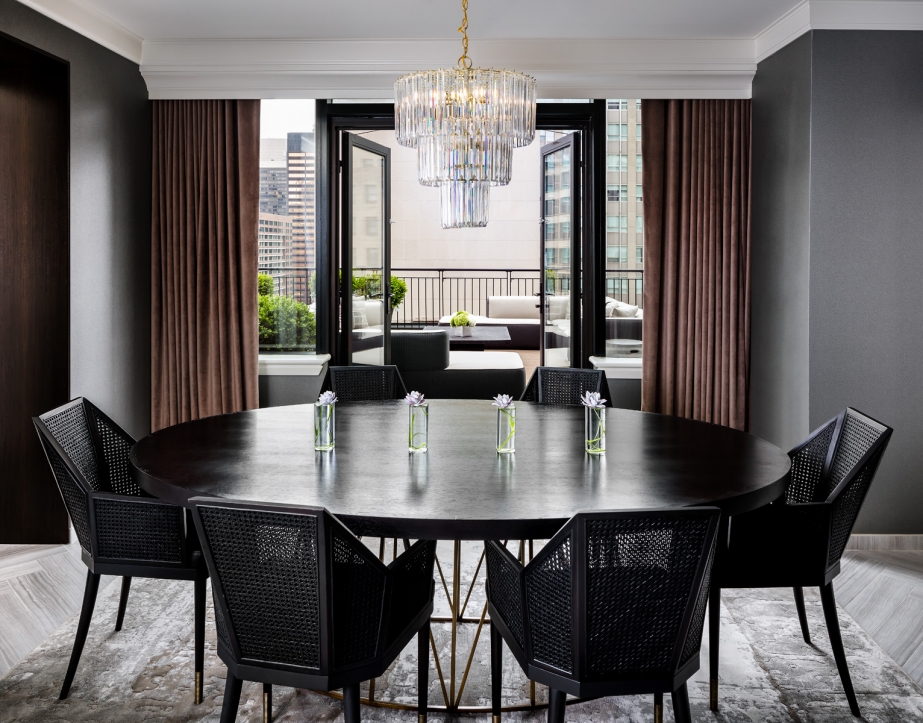 A large circular dinner table in the Gwen Lux Suite.