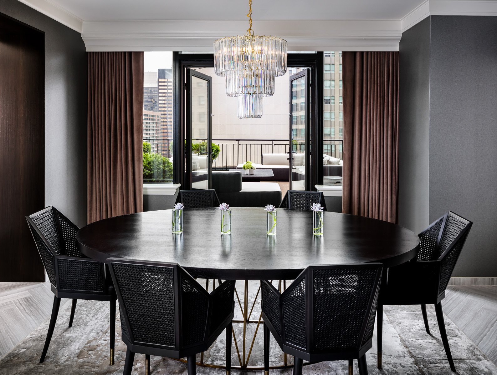 A large circular dinner table in the Gwen Lux Suite.