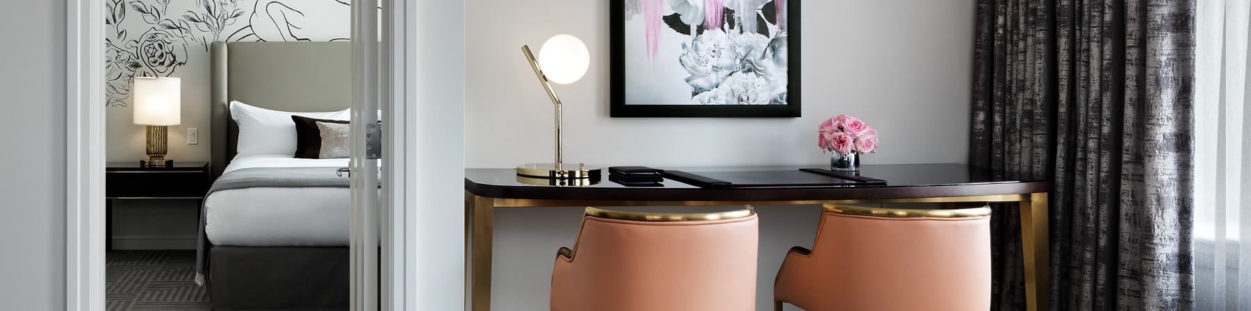 A workstation with two chairs.