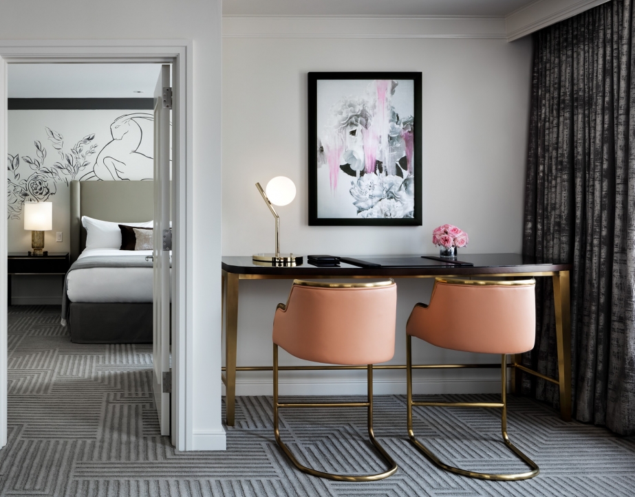 A workstation with two chairs.