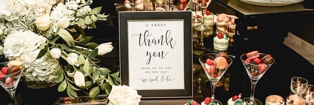 A collection of chocolates and sweets laid out for wedding guests.