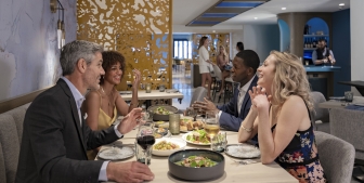 A group dine and chat at Kostali, a downtown Chicago restaurant.