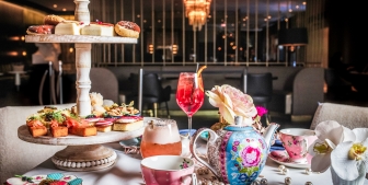 A flight of snacks, tea and desserts served at High Tea at Kostali.
