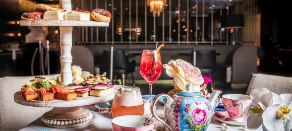 A flight of snacks, tea and desserts served at High Tea at Kostali.