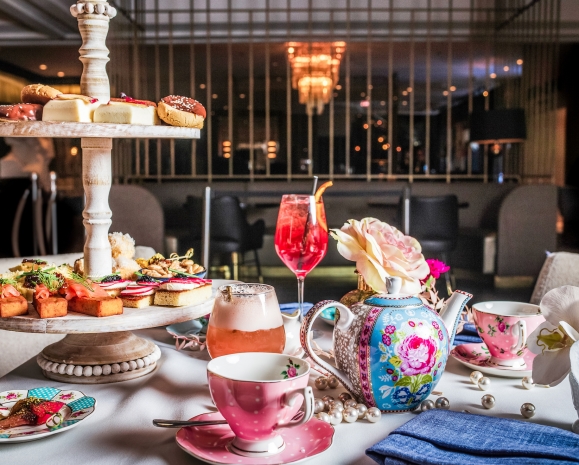 A flight of snacks, tea and desserts served at High Tea at Kostali.