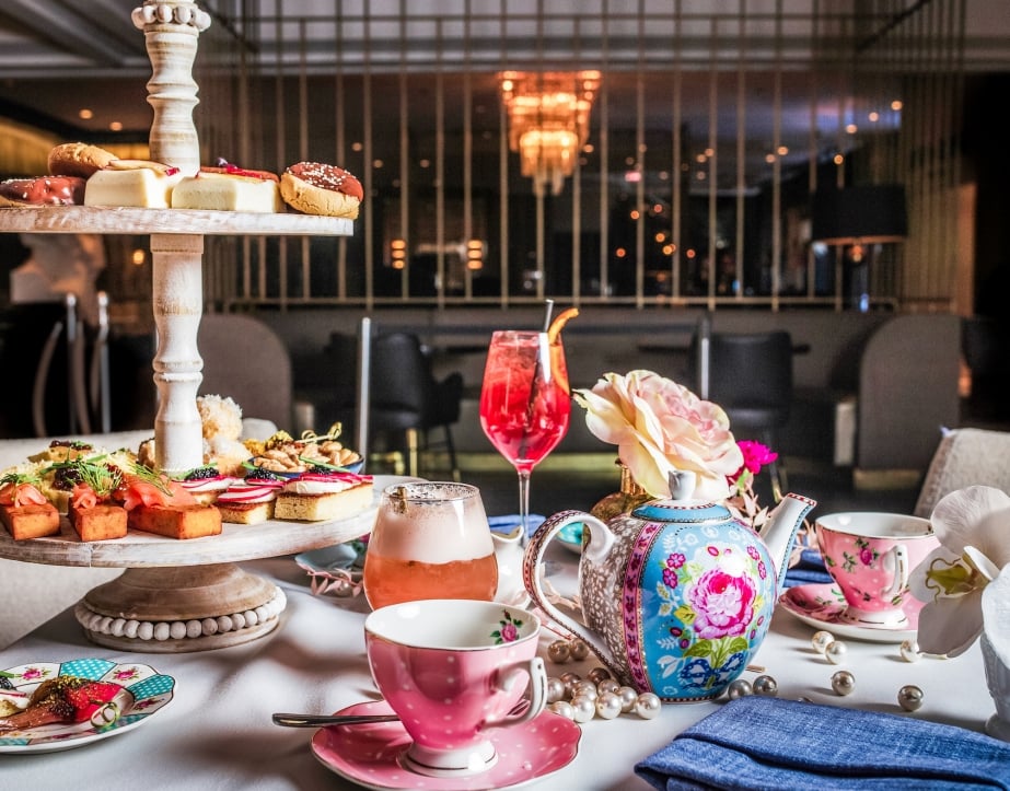A flight of snacks, tea and desserts served at High Tea at Kostali.
