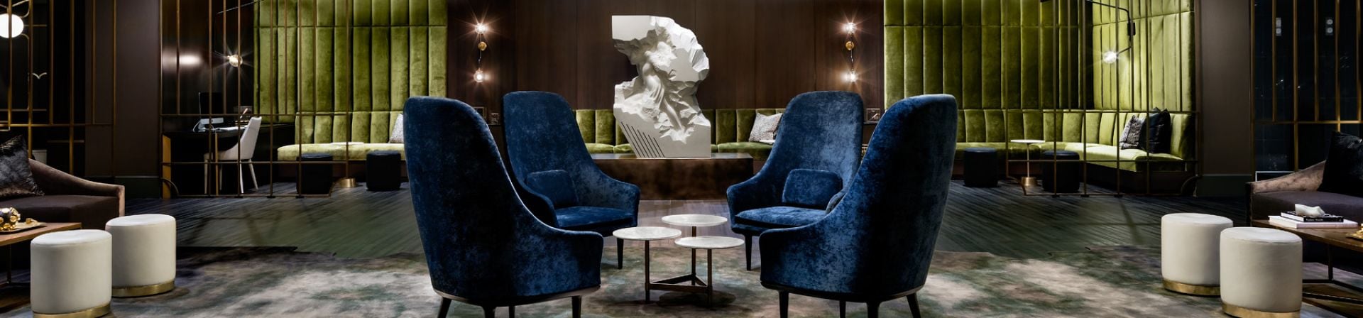 A large three-tiered chandelier in the lobby of The Gwen, a hotel in downtown Chicago.