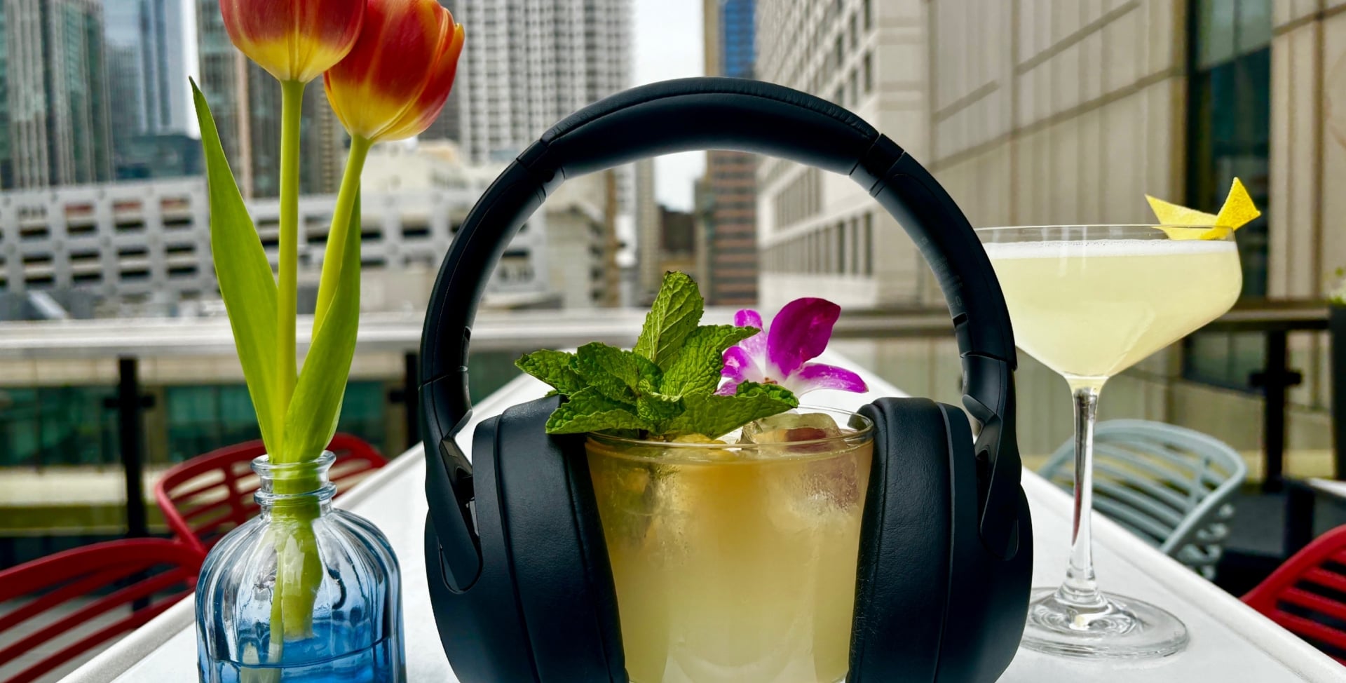 Cocktail with Chicago skyline view for Terrace & Tunes at The Gwen Hotel